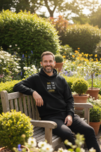 Black hoodie with “DAD: THE MAN, THE MYTH, THE LEGEND” graphic on the chest