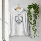 White unisex hoodie hanging on a wooden hanger with “Good Vibes Luna” print