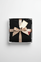 Black embroidered hoodie folded in a gift box with heart patch