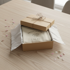 Gift wrapped in kraft box with dried flowers on dining table