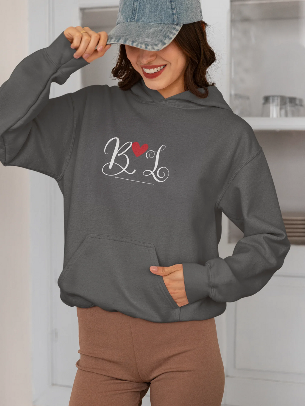 Charcoal hoodie with heart monogram graphic on chest, kangaroo pocket, long sleeves