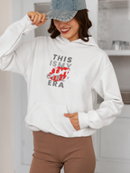 White pullover hoodie on model with front graphic "THIS IS MY BIRTHDAY GIRL ERA"