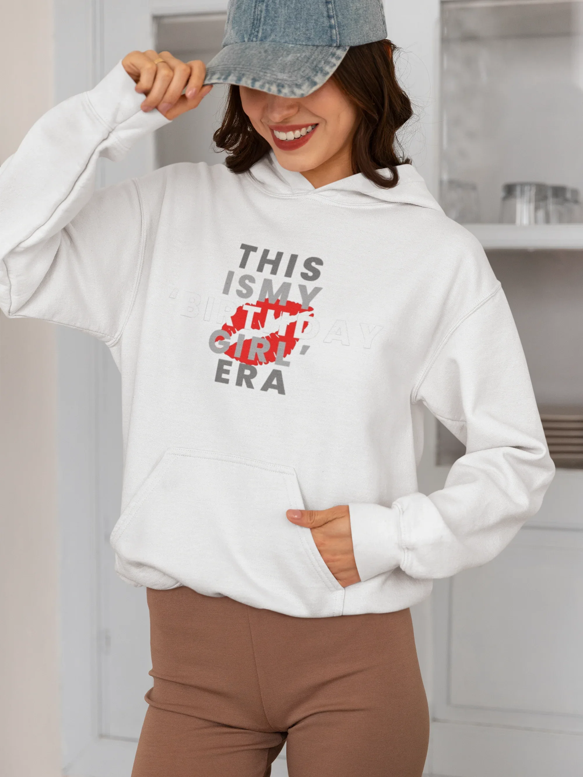 White pullover hoodie on model with front graphic "THIS IS MY BIRTHDAY GIRL ERA"