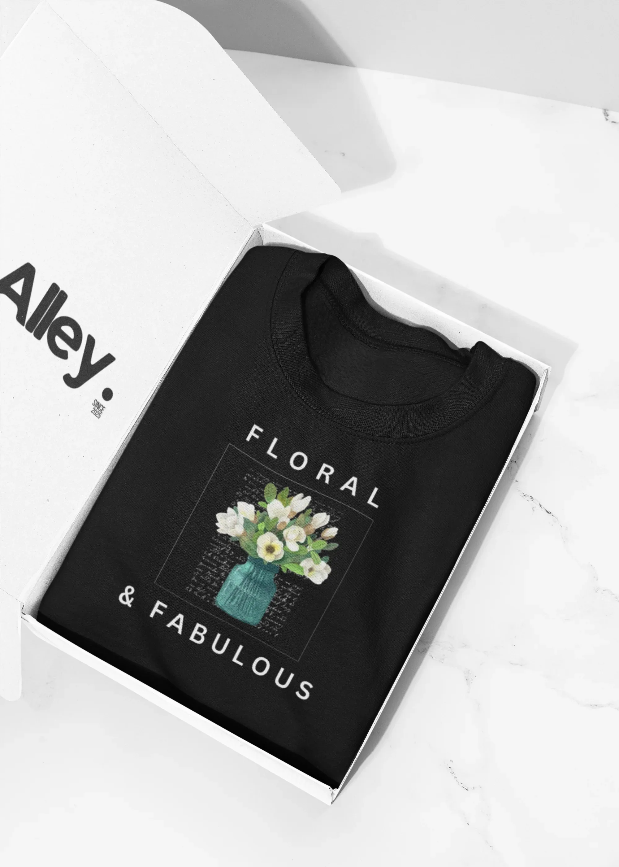 Deep black crewneck sweatshirt with Floral & Fabulous front graphic.