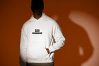 White hooded sweatshirt with chest 'GOD THE KING' logo and kangaroo pocket.