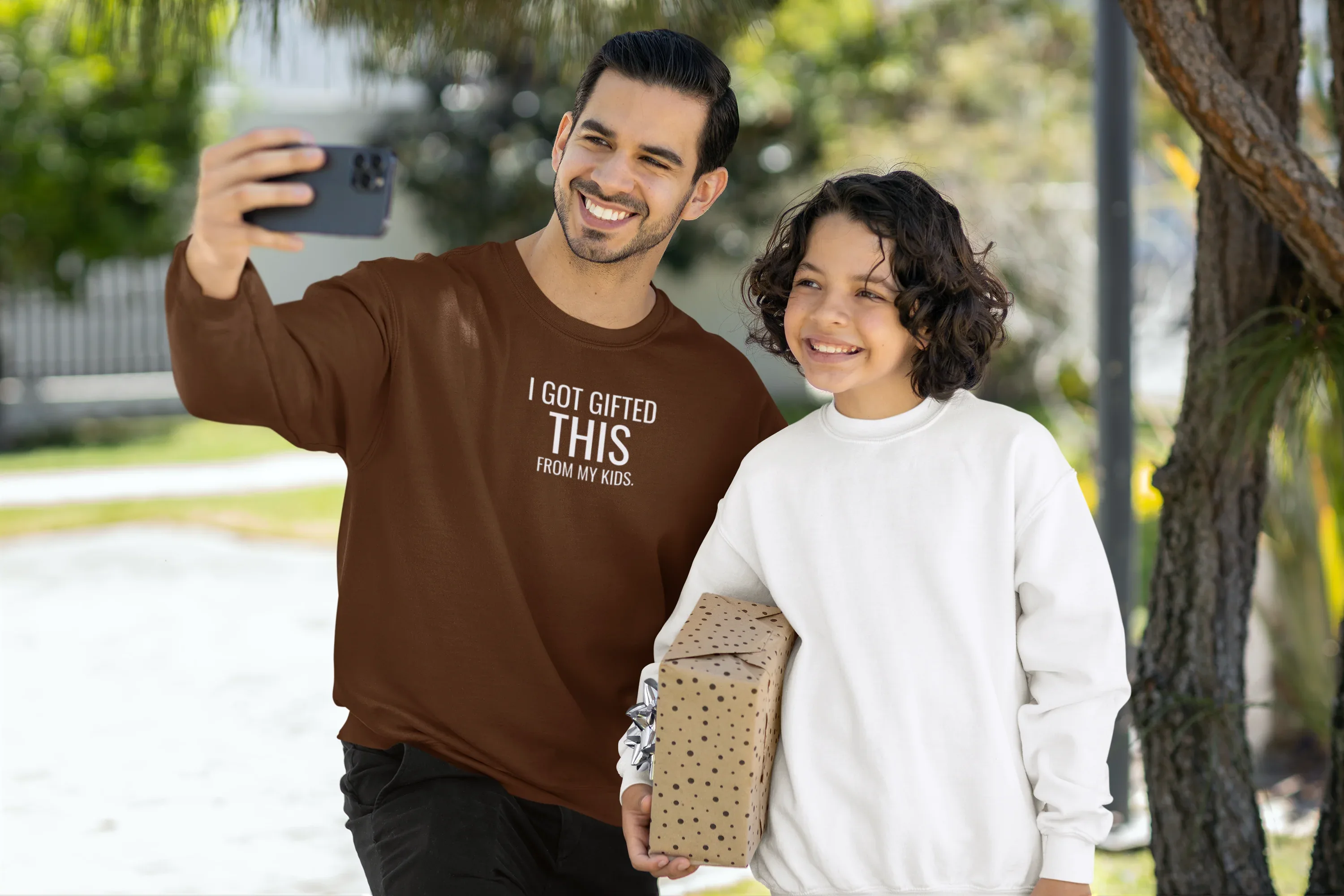 Crewneck brown sweatshirt with chest text 'I got gifted this from my kids'