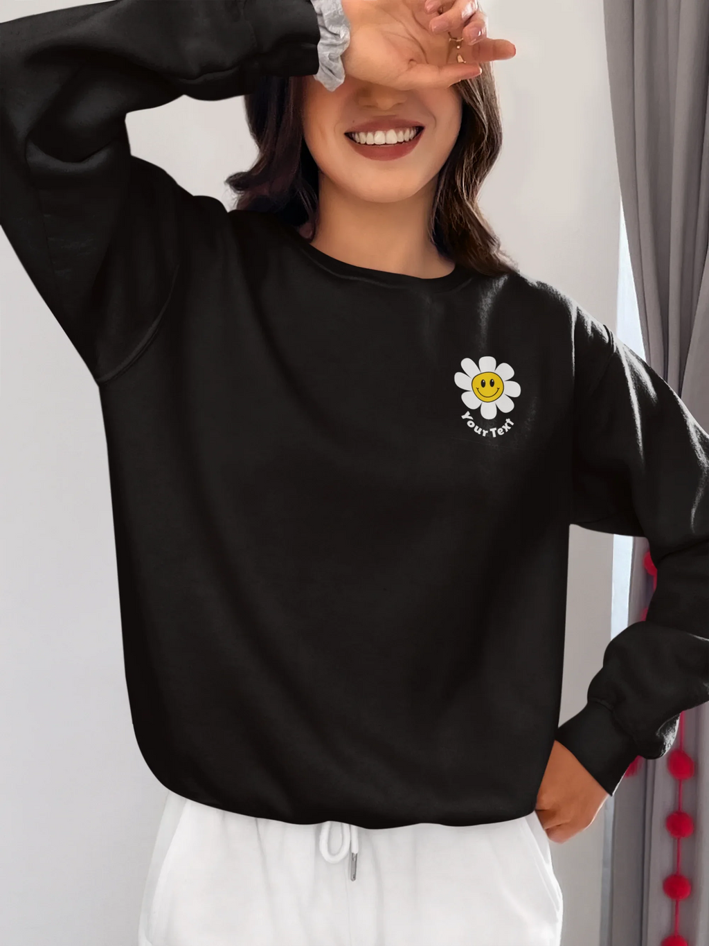 Black unisex sweatshirt with embroidered flower patch on chest
