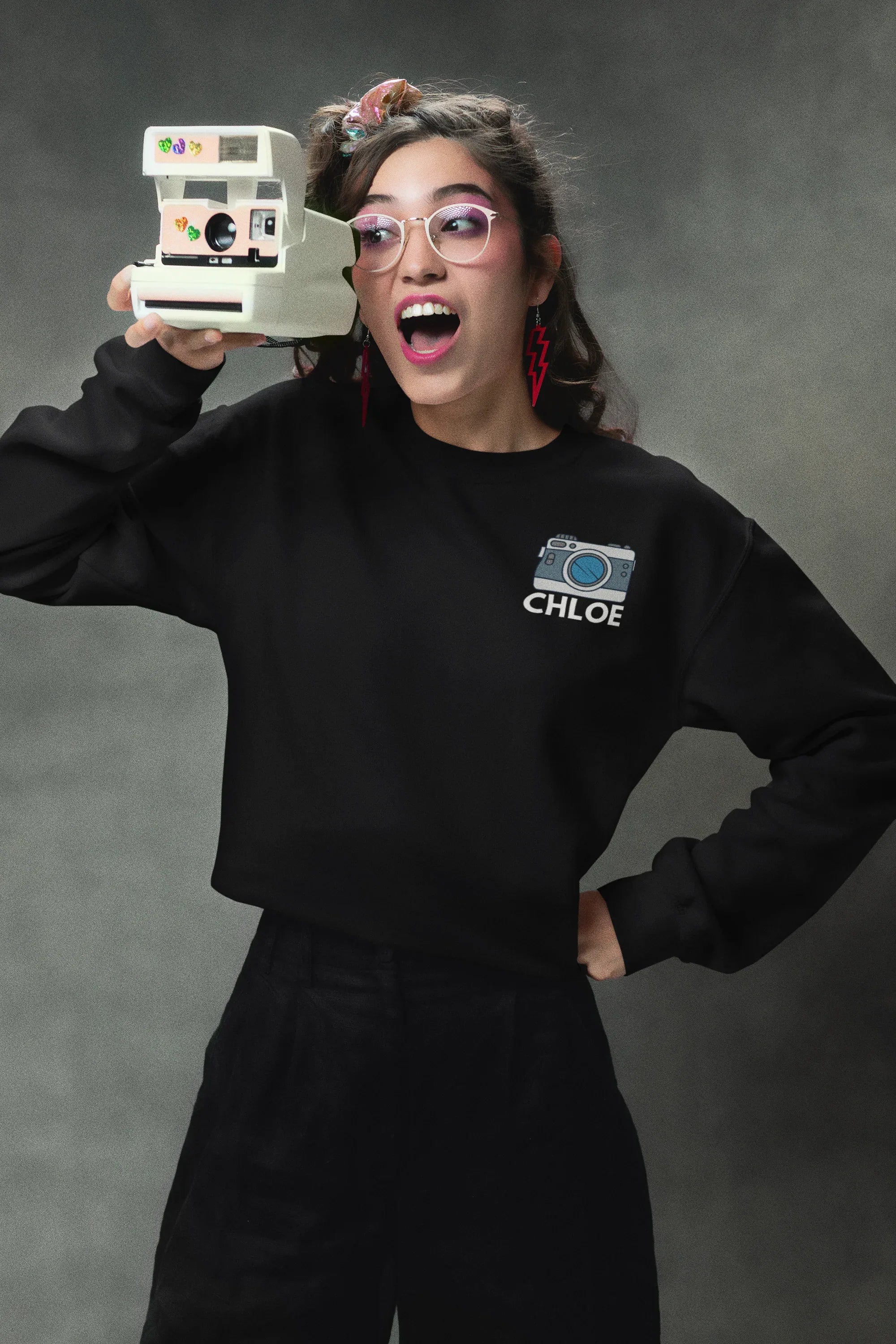Black sweatshirt with embroidered camera icon and name CHLOE on left chest