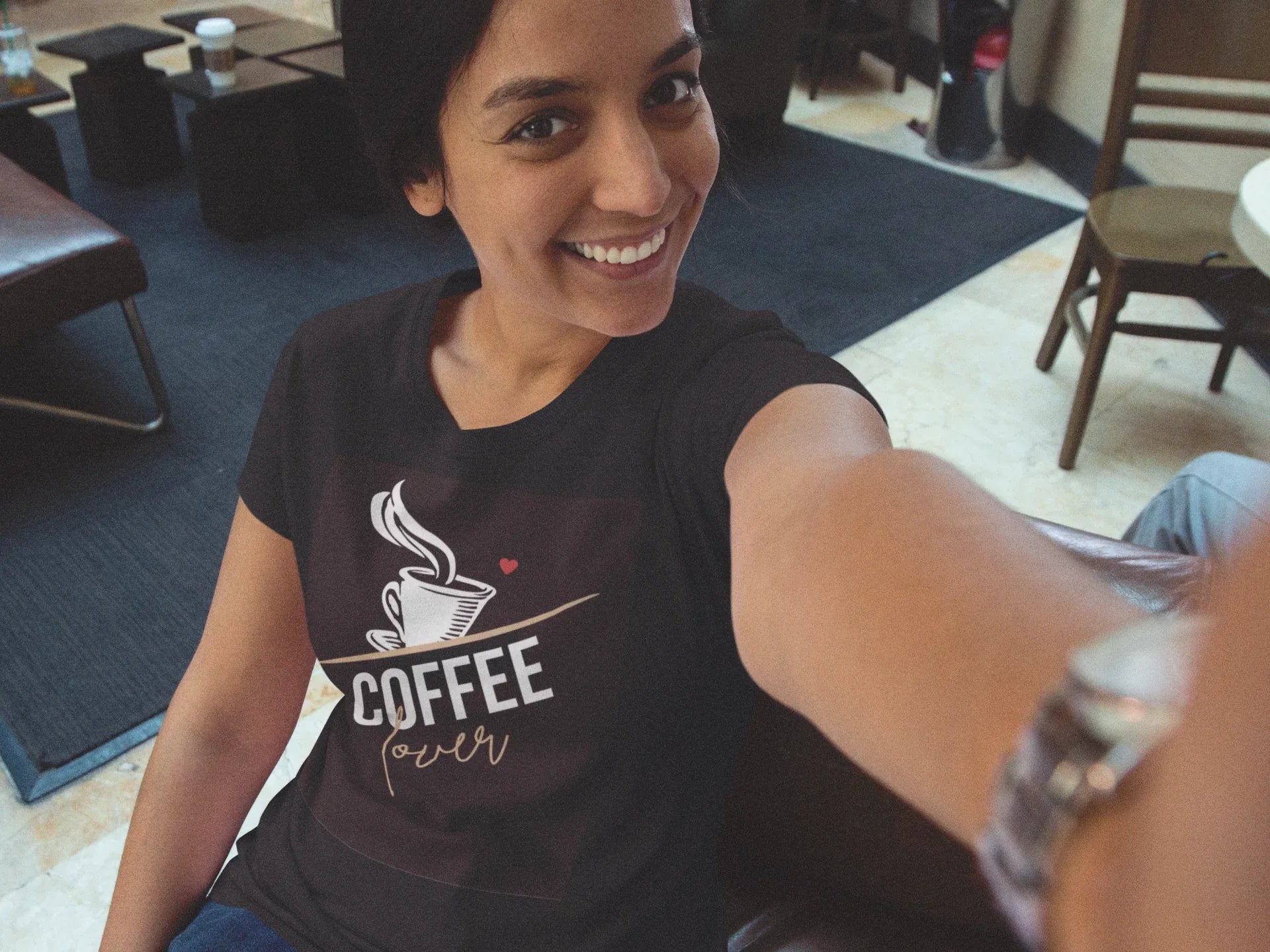 Black unisex T-shirt with coffee cup graphic and small red heart on chest