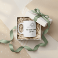 White ceramic coffee mug with 'good luck' quote and heart icon on front