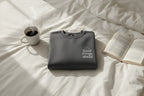 Dark gray crewneck sweatshirt with chest logo, folded flat