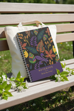A5 floral notebook on outdoor bench with colorful leaf cover and ribbon bow