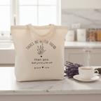 Cream tote bag on table with “There’s No Better Friend” and custom “than you” writing