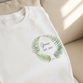 White T-shirt with green fern wreath logo, 'Grace' and EST. 2021