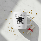 White ceramic graduation mug with 'Congratulations!' 2026 and AMARA name text