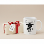 White ceramic graduation mug with 'Congratulations!' 2026 and 23 for RUBY name text