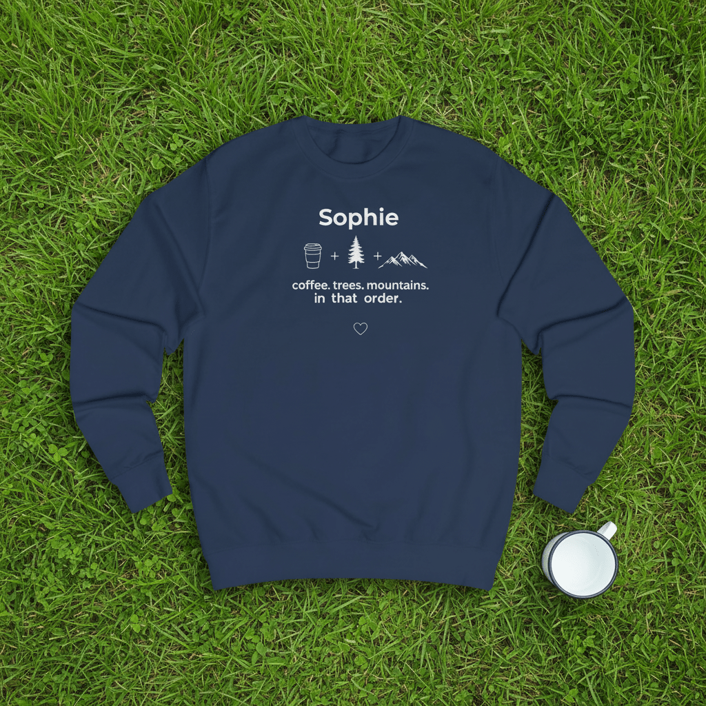 Navy crewneck sweatshirt with name “Sophie” and coffee, trees, mountains graphic, front view.