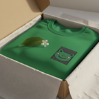 Irish green embroidered frog sweatshirt folded in a box, with crew neck ribbing.