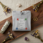 Heather grey pullover hoodie with star “Stay Trippy Little Hippie” front graphic