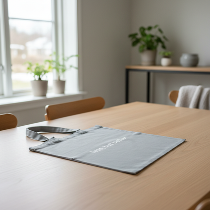 Grey less but better tote on dining table 1