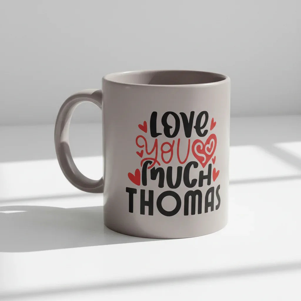 Gray ceramic mug with “Love you much THOMAS” text and red hearts