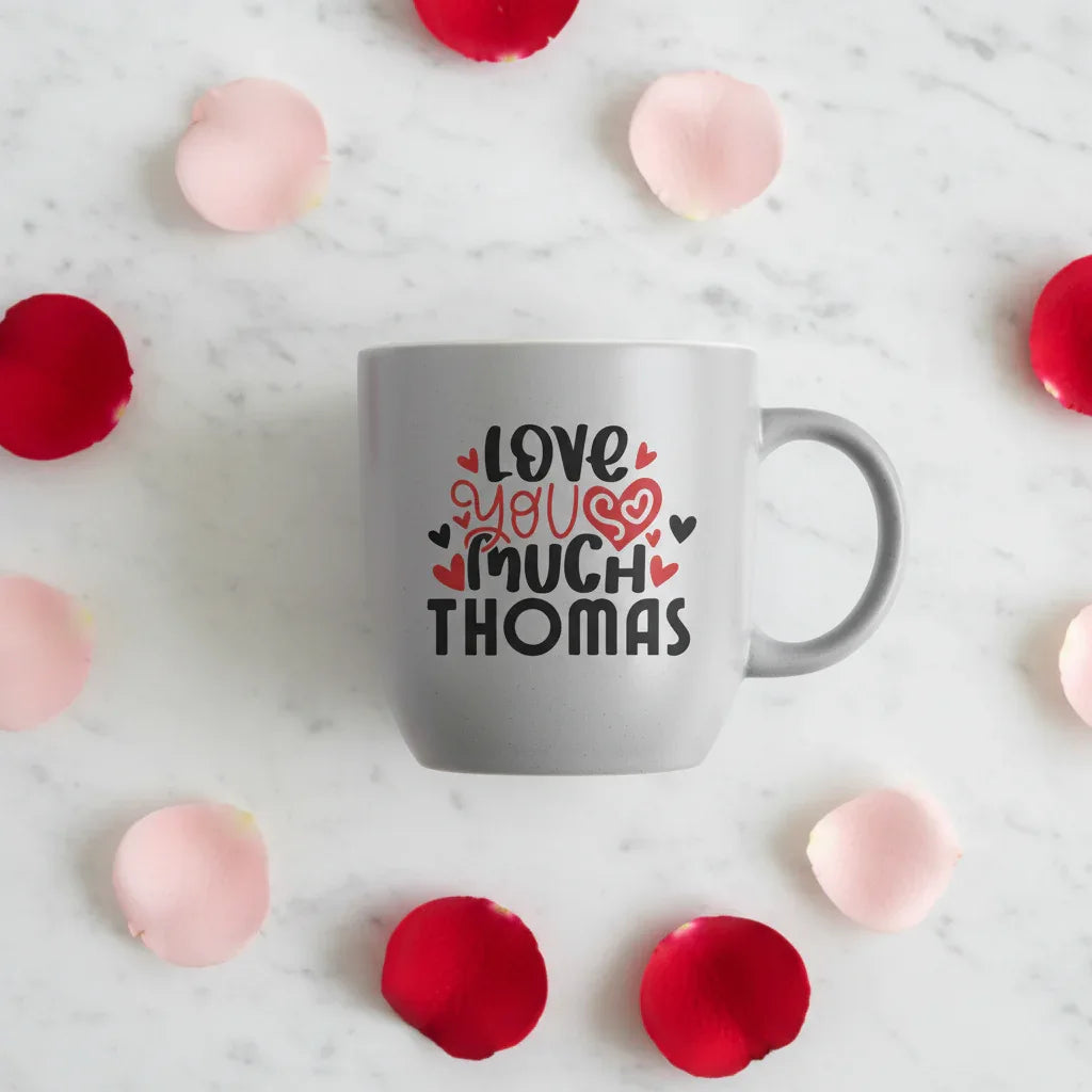 Gray mug with “Love you much THOMAS” print surrounded by hearts