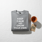 Medium gray crewneck sweatshirt with white text: KEEP CALM AND GROW YOUR OWN