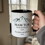 Handheld Mam Tor mug with one Peak District line and elevation only beneath