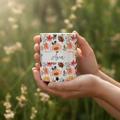 Hands holding Ava mug with nature background