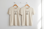 Natural motivational T-shirt with small plant graphic and 'Slow Progress' text