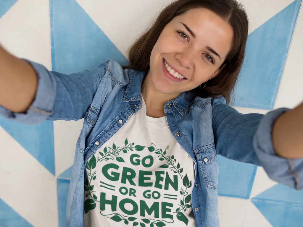 Light tan unisex T-shirt with front graphic print reading "GO GREEN OR GO HOME"