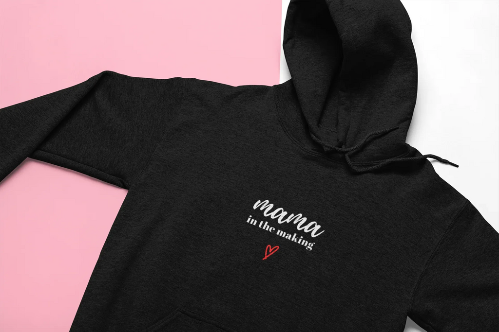 Black hooded sweatshirt with 'mama in the making' print and red heart on chest