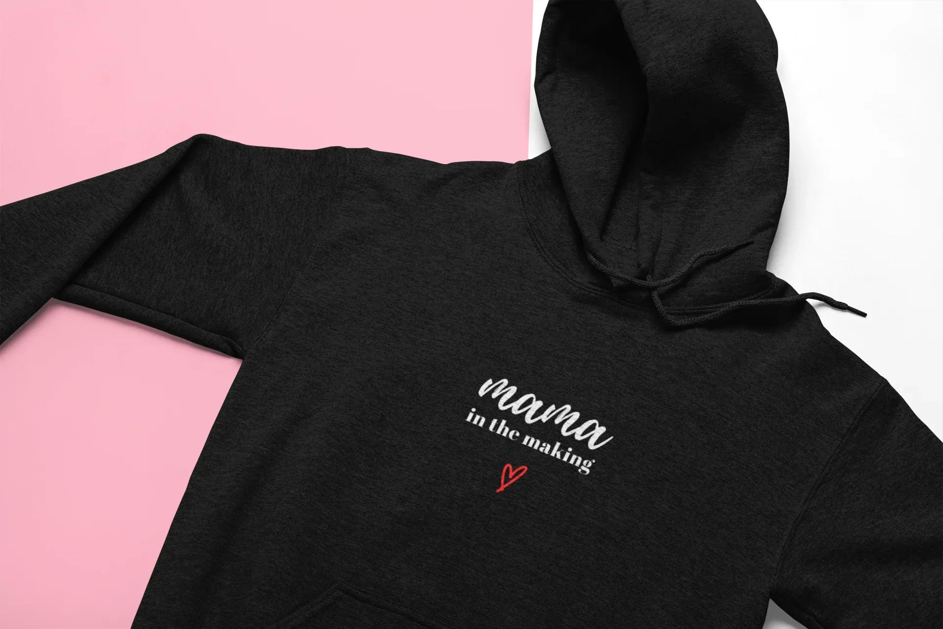 Black hooded sweatshirt with 'mama in the making' print and red heart on chest