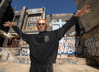 Black minimal graphic hoodie with hood and front pocket, “Stay Wild Moon Child” chest print