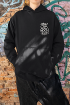Black minimal graphic hoodie with hood and front pocket, “Stay Wild Moon Child” chest print