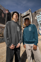 Dark gray and teal minimal graphic hoodies with hood and “Stay Wild Moon Child” chest prints