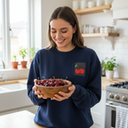 Navy sweatshirt with embroidered cherry patch on chest, long sleeves