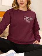 Burgundy long-sleeve sweatshirt with 'This is my BIRTHDAY shirt' chest print