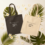Two canvas tote bags: black and natural, each with 'Honeymoon loading..' print and heart