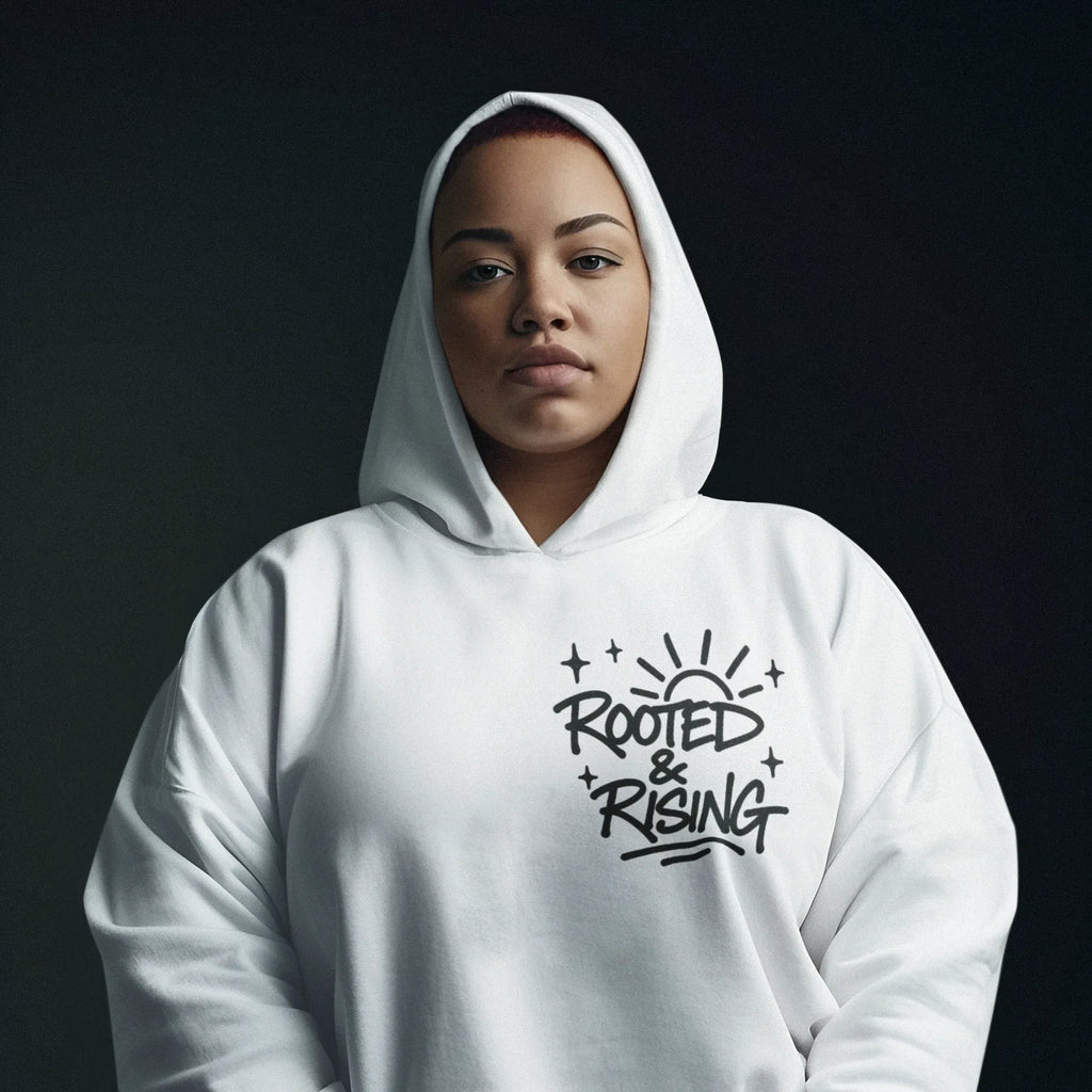 White pullover hoodie with hood up and 'Rooted & Rising' chest logo
