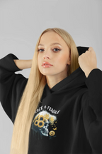 Black hooded sweatshirt with front graphic skull and flower design, long sleeves and pouch pocket.