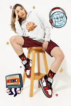 Light gray unisex hooded sweatshirt with colorful chest graphic and drawstrings