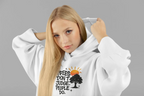 White hoodie worn by a model, featuring a chest graphic with tree and text