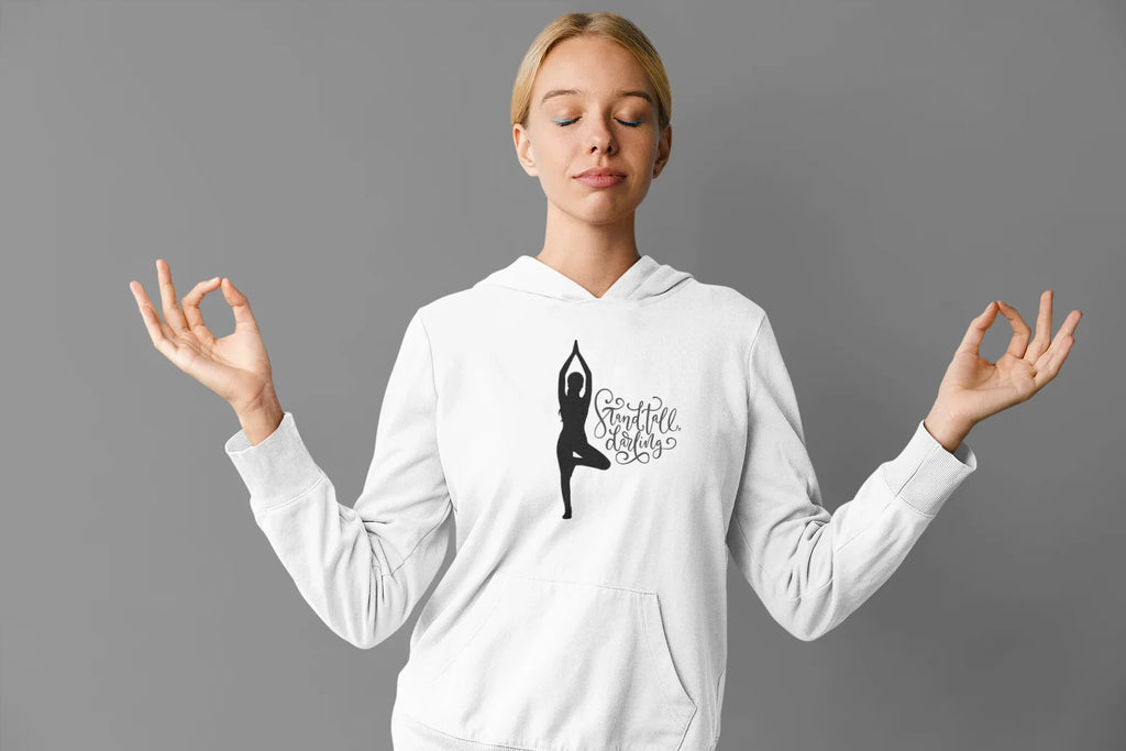 White hoodie with front kangaroo pocket and hood, featuring a yoga silhouette graphic.