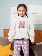 White kids hoodie with hood and front pocket, featuring a pink donut graphic centerpiece.