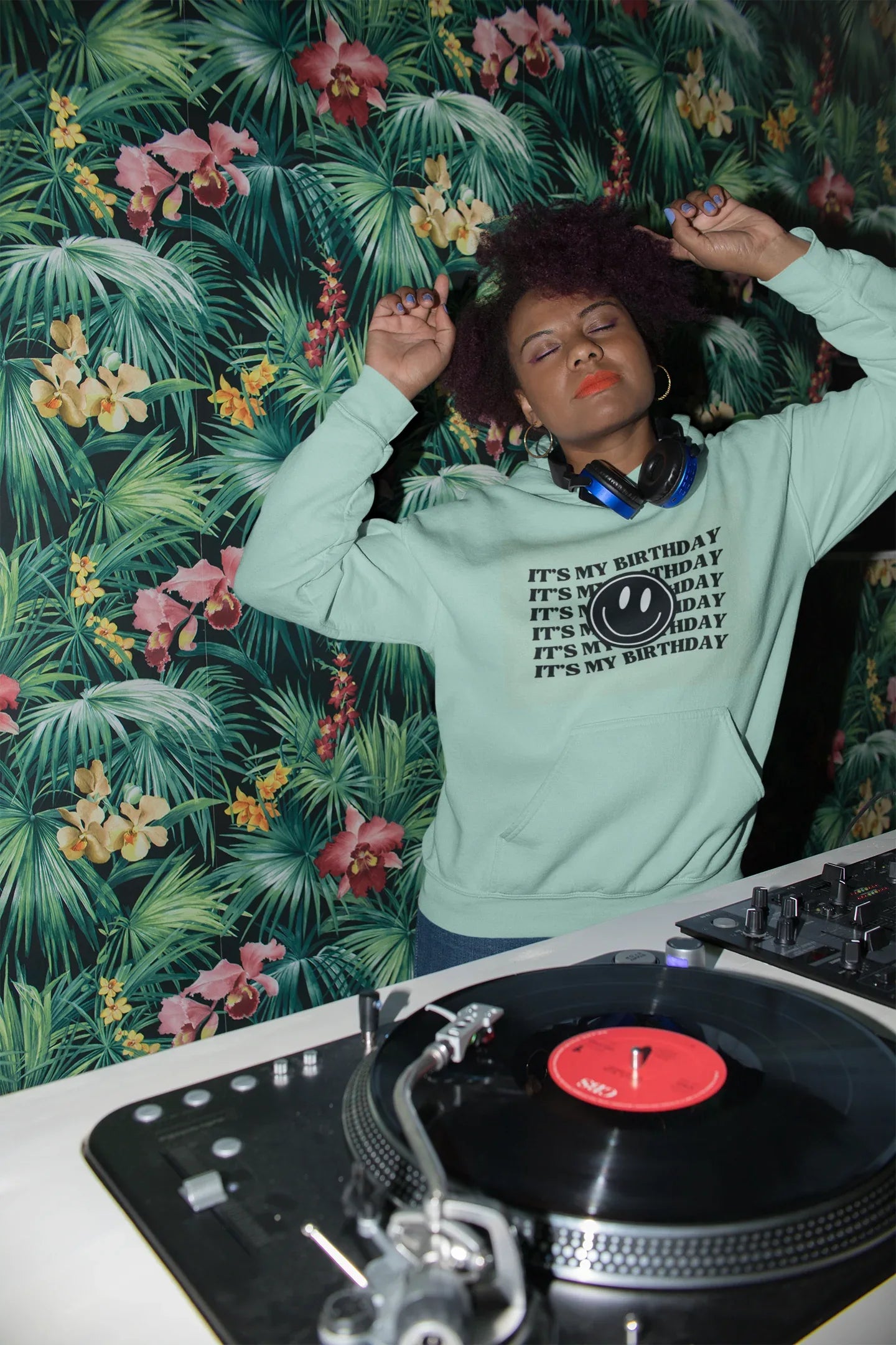 Mint green hooded sweatshirt with kangaroo pocket and birthday logo graphic print