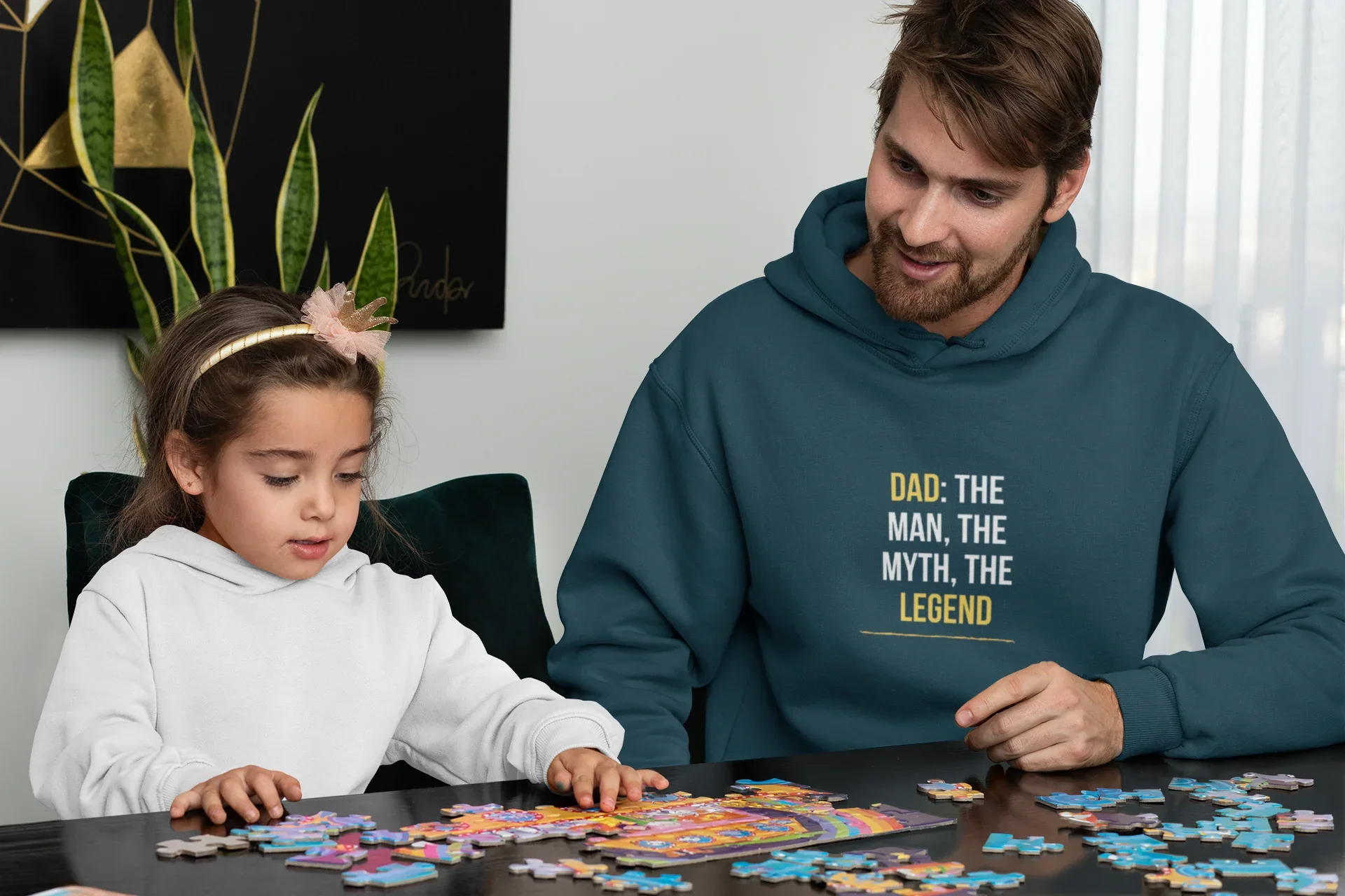 Teal hoodie with “DAD: THE MAN, THE MYTH, THE LEGEND” graphic on the chest