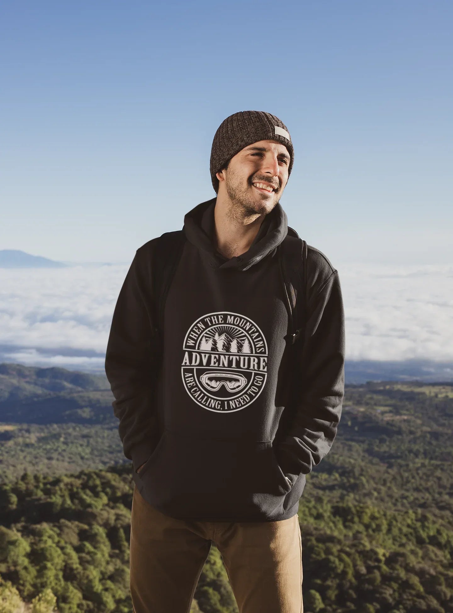 Black pullover hoodie with hood and circular “Adventure” logo on the chest.