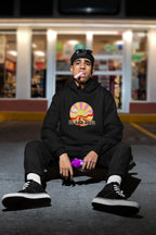 Black unisex hooded sweatshirt with colorful sun graphic and front kangaroo pocket