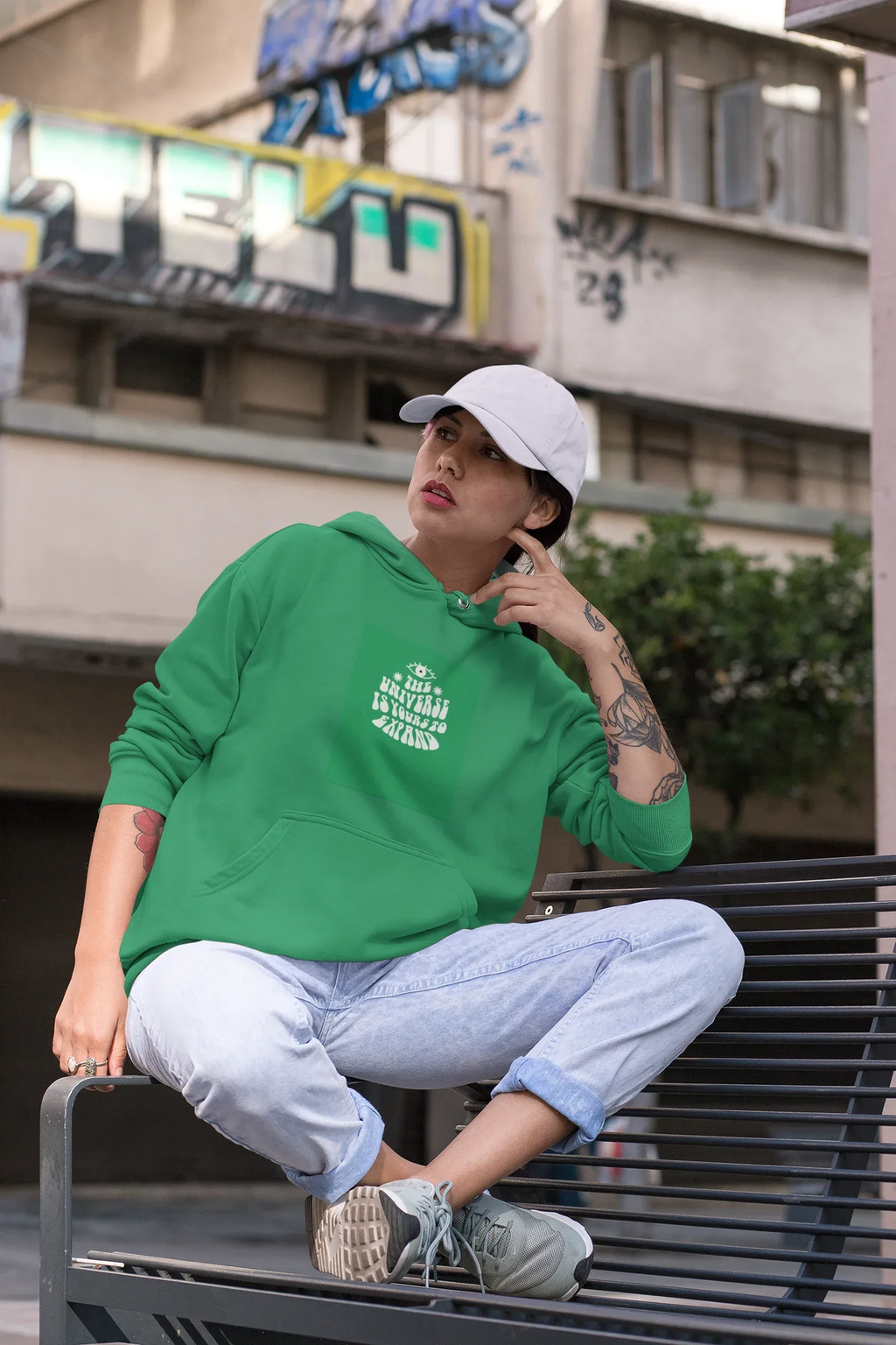 Green unisex hoodie with drawstring hood and chest logo